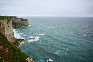 Ocean horizon and layered cliffs near Etretat, Normandy