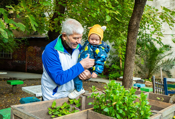 A man is holding a baby in his arms
