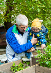 A man is holding a baby in his arms