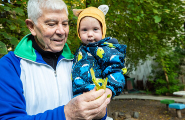 A man is holding a baby in his arms