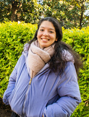A woman wearing a blue jacket and a scarf