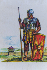 Printed painted illustration of a Roman legionary on a vintage-style card. 
