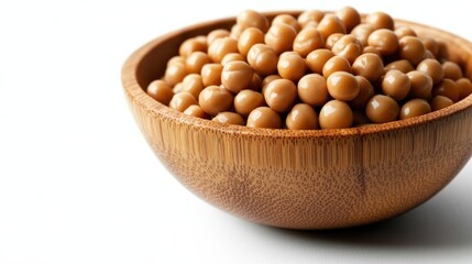 This image showcases a beautifully crafted wooden bowl filled with shiny brown soybeans, highlighting the simple beauty of natural foods and healthy eating.