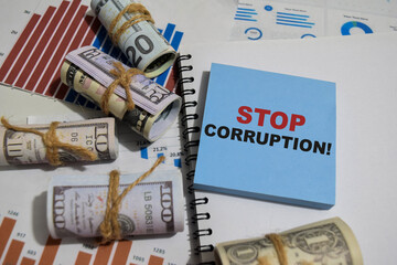 Concept of Stop corruption write on sticky notes isolated on Wooden Table.