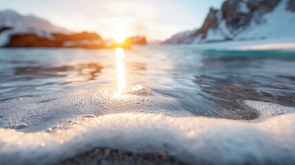 The tranquil moment captures a serene sunset illuminating the ocean's surface, highlighting the gentle waves and creating a peaceful ambiance for viewers.