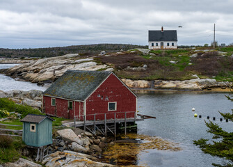 Fishermen cottages overlooks the harbour of Peggys Cove near Halifax in Nova Scotia, Canada