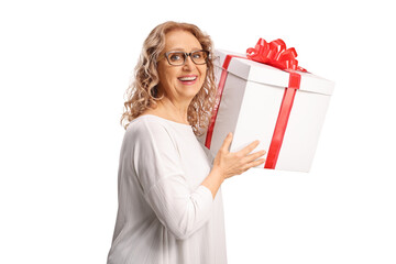 Happy middle aged woman holding a gift box