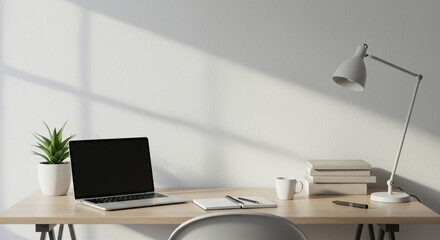 Minimalist home office setup with laptop plant and desk lamp for remote work and study space design