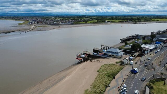 aerial drone view of the river Wyre at Fleetwood in Lancashire showing the ferry terminal and launching facility with the village of Knott End on the opposite bank