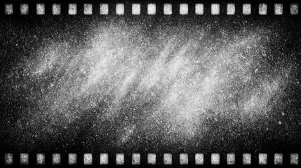 Black and white film filter texture with grainy appearance. The image features a film strip border with a blurred, soft focus center.