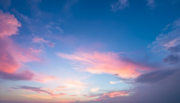 sky in the pink and blue colors effect of light pastel colored of sunset clouds cloud on the sunset sky background with a pastel color