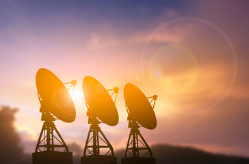 Satellite Radar Dishes Silhouette at Dusk
