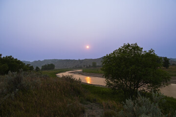 Sunset and reflection in the Little Missouri River at Theodore Roosevelt National Park, North Dakota