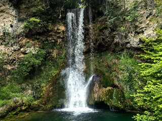 Beautiful waterfall. Small mountain river with natural water cascade