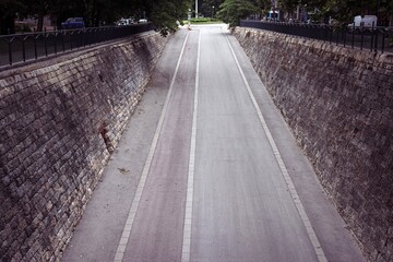 Empty Urban Underpass with Stone Walls in the city of Ruse in Bulgaria leading to the park next to Danube river on the border with Romania