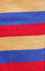 multicolored textile carpet in exposition on market