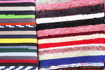 multicolored textile carpet in exposition on market