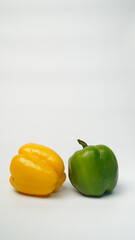 Sweet pepper, green, yellow paprika on white background