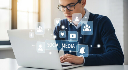 Man using laptop with social media icons overlayed for online marketing and business promotion work