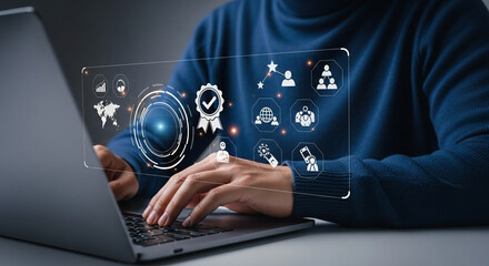 Person using laptop with digital interface displaying quality assurance and business analytics icons