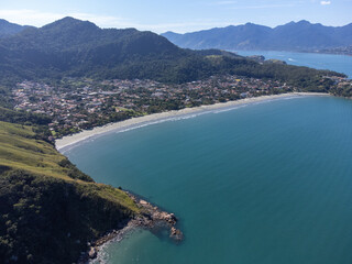 Mountain with dirt road in the middle of nature with views to two incredible beaches with turquoise...
