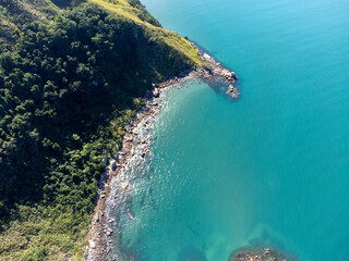 amazing turquoise blue sea water with sea stones