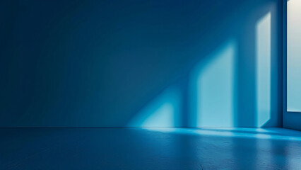 Blue wall with dramatic shadows from window light in minimal space