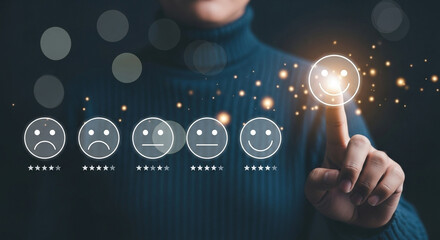 Person selecting a happy face on a customer satisfaction survey with glowing particles around it
