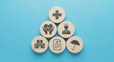 Health and insurance icons arranged in a pyramid shape on a light blue background, top down view