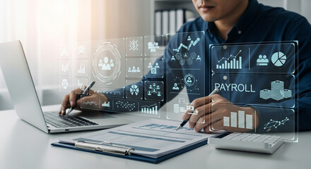 Man working on laptop with payroll interface and data analysis charts overlaying the workspace