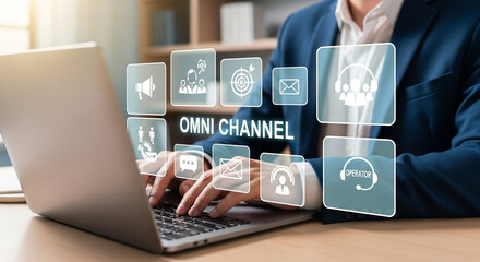 Man typing on laptop with omni channel icons displayed above the keyboard in a bright setting