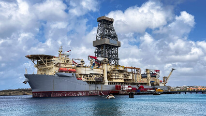 Portrait Drill Ship is called "NOBLE VOYAGER", while standing close to Caribbean Island Curacao. Ship is drilling for the oil and gas and is consider as  modern, versatile, and technically advanced 