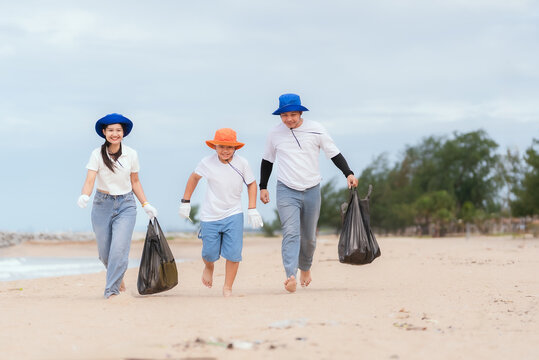 Volunteers clean up the beach while enjoying a sunny day at the shoreline in a community effort to protect the environment
