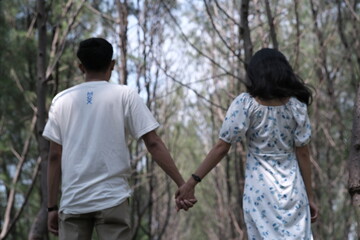 young couple walking in park
