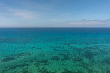 Sea surface with corals in Bantayan, Cebu. Philippines. Seascape with turquoise sea water.