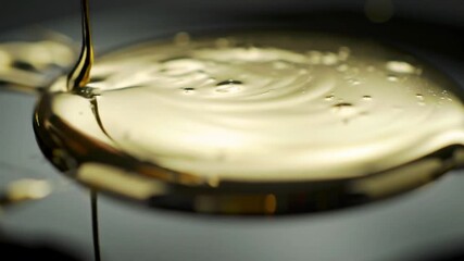 Liquid gold or molten metal flowing slowly, creating a luxurious texture. - Powered by Adobe