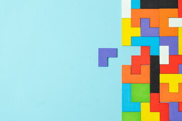 geometric shape block with colorful wood puzzle piece background. logical thinking, business logic, Conundrum, decision, solutions, rational, mission, success, goals and strategy concepts