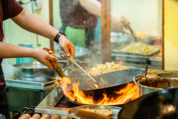 Pad Thai noodles is fried noodles cook in pan with big fire flame is hong kong style. Pad Thai...