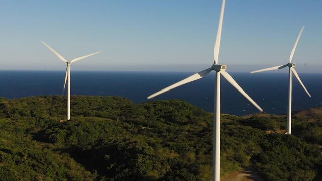 Wind Farm with wind turbines on the seashore. Wind power plant. Philippines.