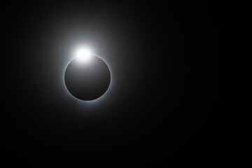 Solar eclipse, totality just starting looking like a diamond ring, solar flares and corona visible