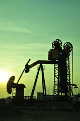 Drilling rig at sunset
