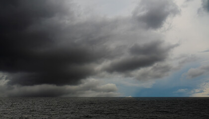 Cloud storm sky dark rain lightning thunder on sea ocean stormy typhoon nature light scene rainy...
