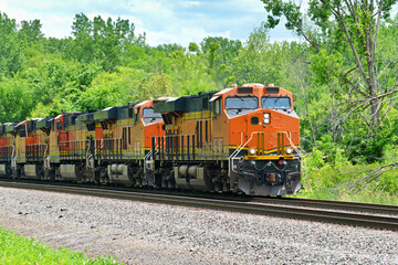 A string of Diesel locomotives pulling a freight train