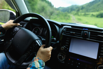 Driving off road car in the summer forest mountains