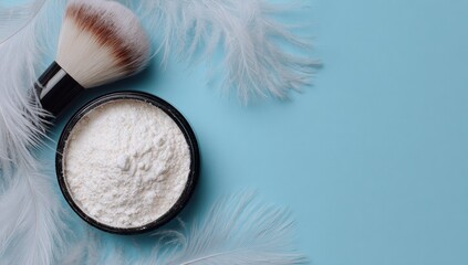 Powder, brush, and feathers on light blue