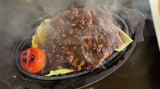 Chicken sizzler prepared in a restaurant in Kolkata