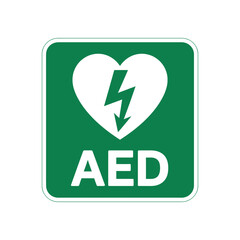 green aed sign featuring white heart and lightning bolt symbol indicating location of automated external defibrillator for emergencies