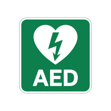 green aed sign featuring white heart and lightning bolt symbol indicating location of automated external defibrillator for emergencies