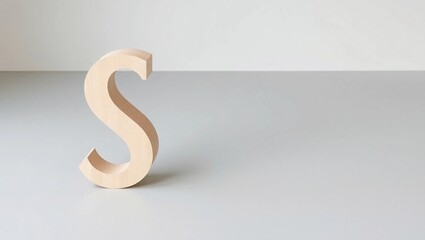 Curved Wooden Letter S Made from Pale Ash Wood – Sleek Minimalist Alphabet Design with Natural Texture, Positioned on Soft Gray Floor with Empty Space for Mockup or Typography Use