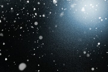 Flurry of white particles is floating in 3D render with dark backdrop, soft glow illuminating dust